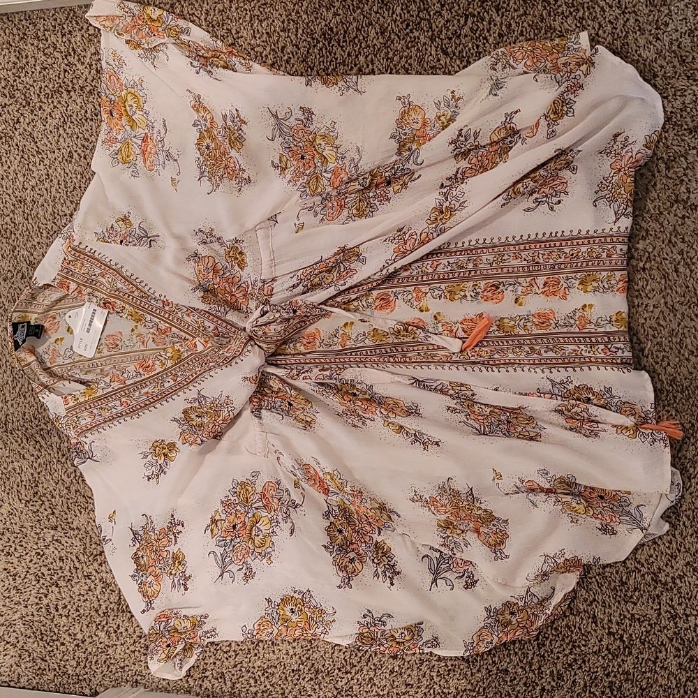 Dress or long shirt, never worn still has tags string to tighten under chest.
